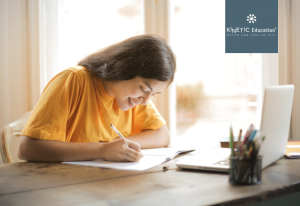 Girl studying at desk.