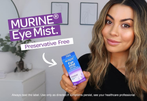 Lady holding Murine Eye Mist box.