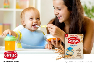 Mum feeding toddler cerelac.