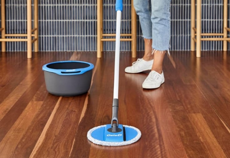 Lady mopping with the Oates Spin & Clean Microfibre Mop Refill.