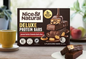 Nice & Natural Deluxe Peanut Butter Brownie Dark Choc Protein Bars on bench.