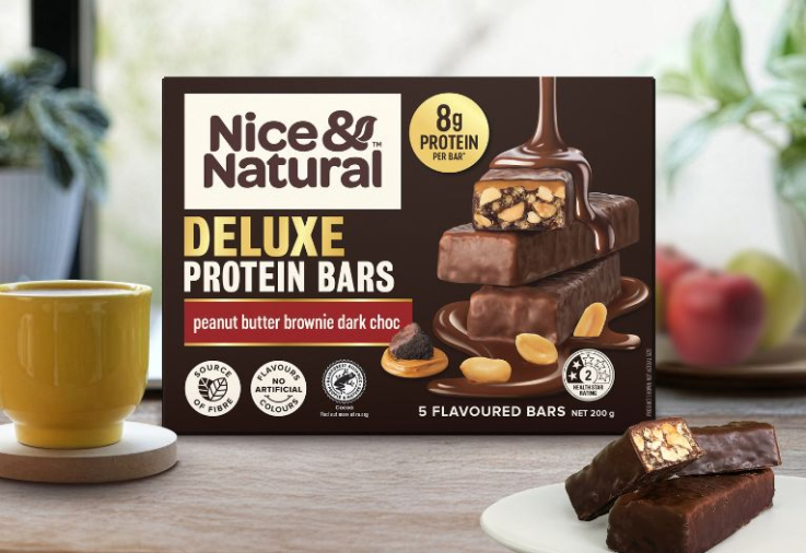 Nice & Natural Deluxe Peanut Butter Brownie Dark Choc Protein Bars on bench.